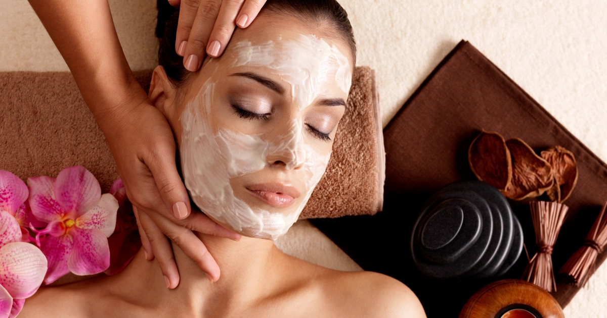 Woman receiving a Carbon Laser Facial treatment with a cream mask at a spa in Laguna Hills, CA.